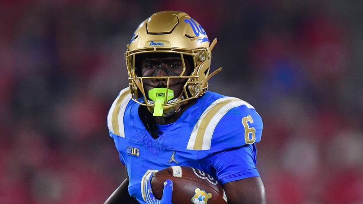  Nov 8, 2025; Pasadena, California, USA; UCLA Bruins running back Anthony Woods (6) runs the ball against the Nebraska Cornhuskers during the second half at the Rose Bowl. Mandatory Credit: Gary A. Vasquez-Imagn Images | Gary A. Vasquez-Imagn Images 