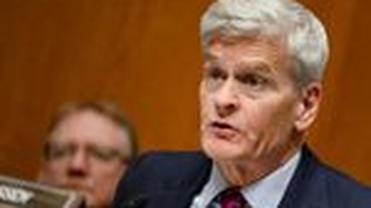 FILE PHOTO: U.S. Senator Bill Cassidy looks on as U.S. Health and Human Services Secretary Robert F. Kennedy Jr. testifies before a Senate Health, Education, Labor, and Pensions Committee hearing on U.S. President Donald Trump's budget request for the Department of Health and Human Services on Capitol Hill in Washington, D.C., U.S., April 22, 2026. REUTERS/Annabelle Gordon/File Photo