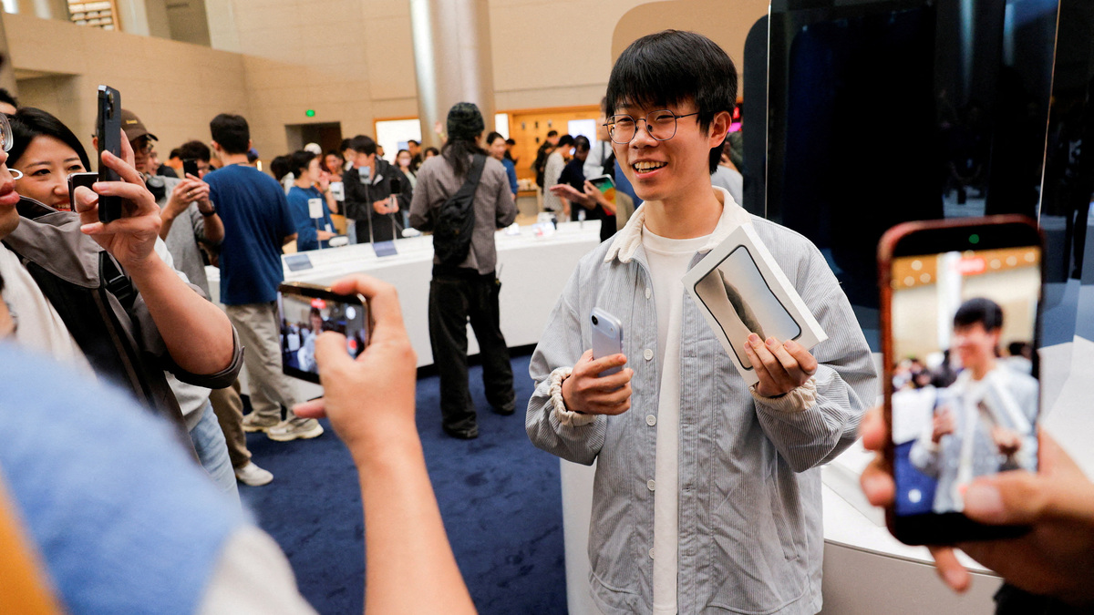 'Truly something cool': Apple fans react as iPhone Duo hits stores ...