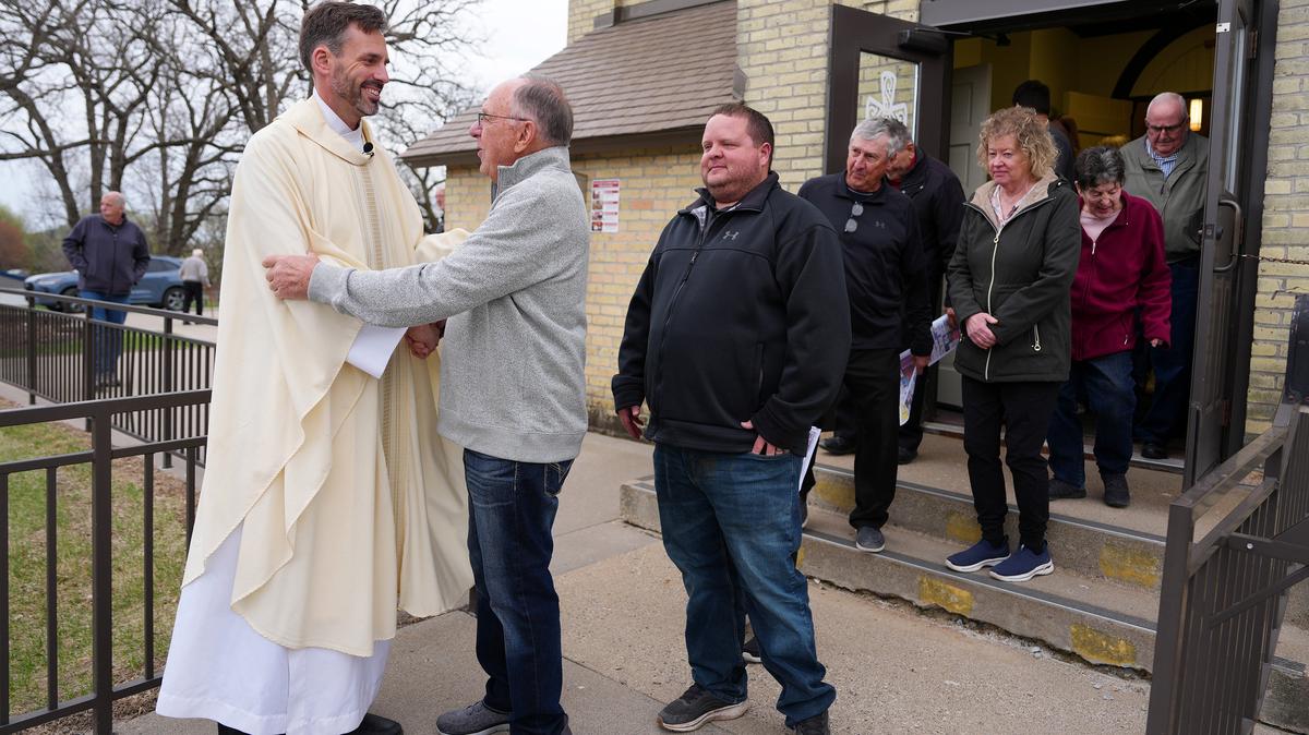 The Rev. Erik Lundgren greets parishioners following afternoon Mass Saturday, April 25, 2026, at Holy Cross Catholic Church in Kimball, Minn. (Anthony Souffle/The Minnesota Star Tribune/TNS)