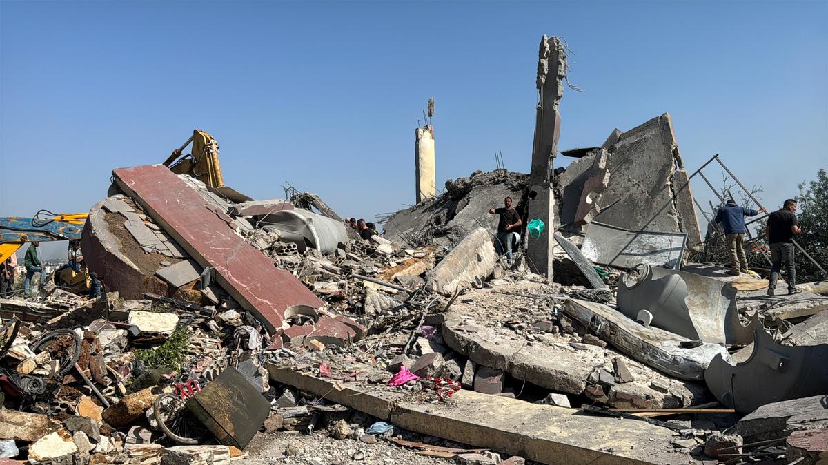 People inspect the site of an Israeli strike in Saksakiyeh, Lebanon, May 9, 2026. Picture taken with a mobile phone. REUTERS/Stringer