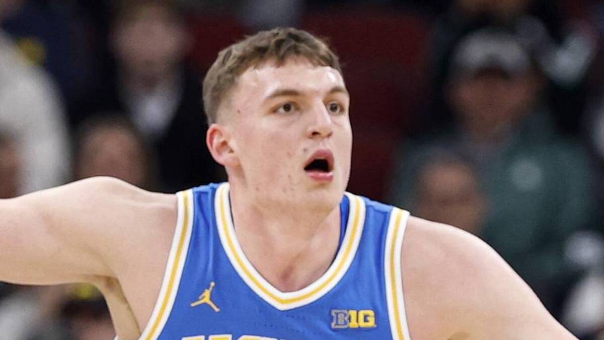  Mar 13, 2026; Chicago, IL, USA; UCLA Bruins forward Tyler Bilodeau (34) defends against Michigan State Spartans center Carson Cooper (15) during the first half at United Center. Mandatory Credit: Kamil Krzaczynski-Imagn Images | Kamil Krzaczynski-Imagn Images 