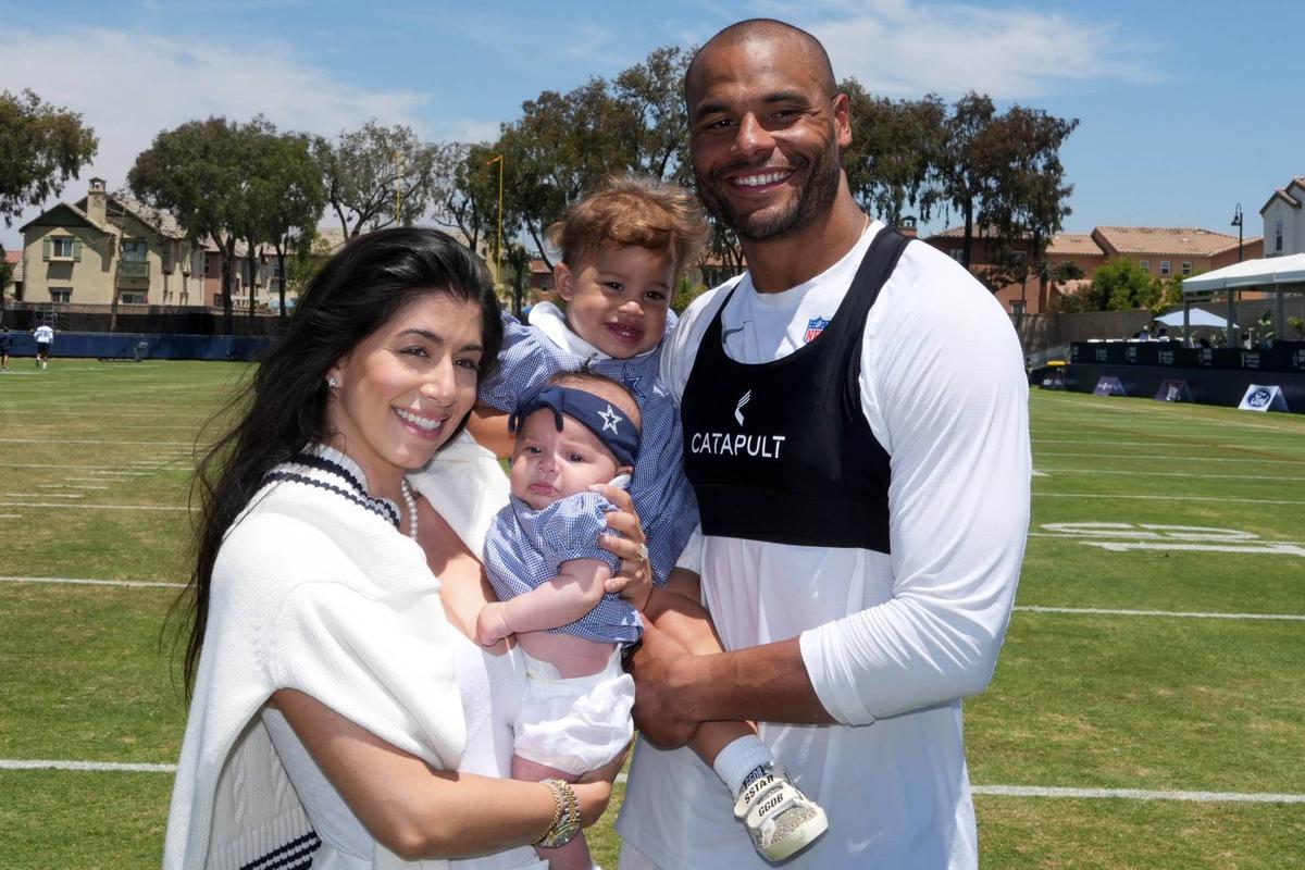  Jul 26, 2025; Oxnard, CA, USA; Dallas Cowboys quarterback Dak Prescott poses with fiancee Sarah Jane Ramos and daughters MJ Rose Prescott and Aurora Prescott at training camp at the River Ridge Fields. Mandatory Credit: Kirby Lee-Imagn Images 