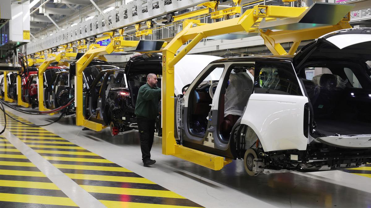 A member of staff works on the production line at Jaguar Land Rover’s factory in Solihull, Britain, December 15, 2022. REUTERS/Phil Noble