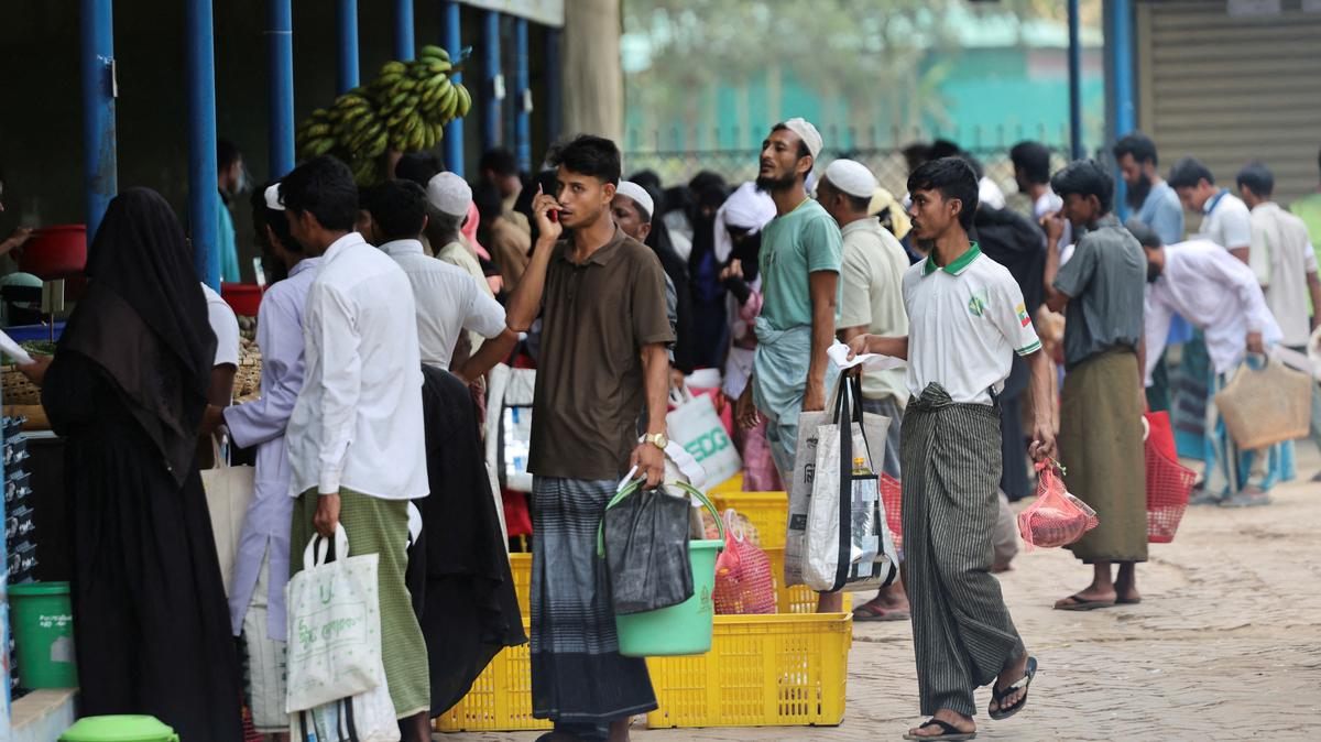 FILE PHOTO: Rohingya refugees stand in queue to receive ration from the World Food Program(WFP), at a refugee camp in Cox's Bazar, Bangladesh, April 18, 2026. REUTERS/Mohammad Ponir Hossain/File Photo