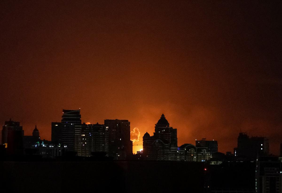An explosion lights up the sky over the city during a Russian missile and drone strike, amid Russia's attack on Ukraine, in Kyiv, Ukraine May 24, 2026. REUTERS/Gleb Garanich