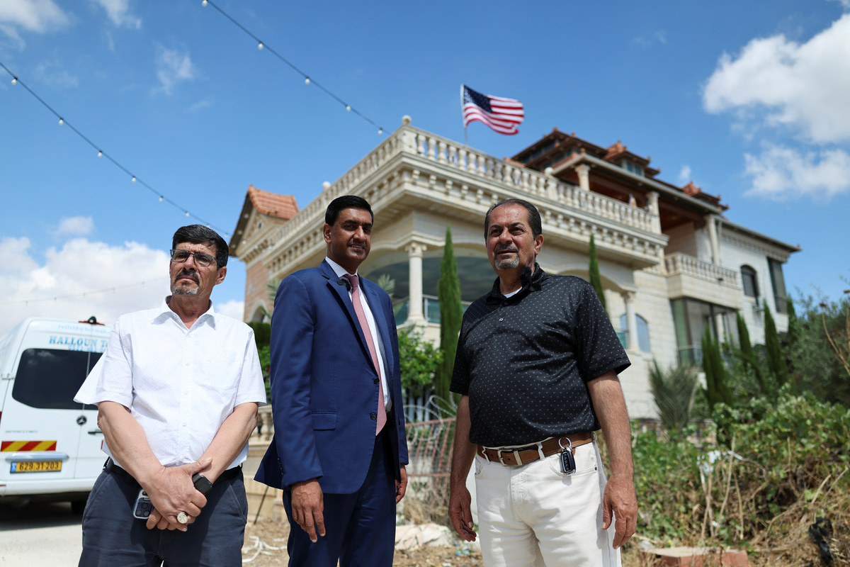 U.S. Representative Ro Khanna (D-CA) stands next to Palestinian residents of Turmus Ayya, near Ramallah, during a visit in the Israeli-occupied West Bank, July 9, 2026. REUTERS/Ammar Awad