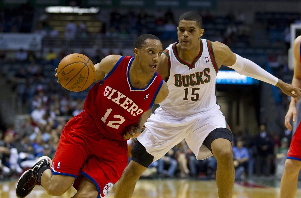 Apr 25, 2012; Milwaukee, WI, USA; Philadelphia 76ers guard Evan Turner (12) drives to the basket as Milwaukee Bucks forward Tobias Harris (15) defends during the second quarter at the Bradley Center. Mandatory Credit: Jeff Hanisch-USA TODAY Sports