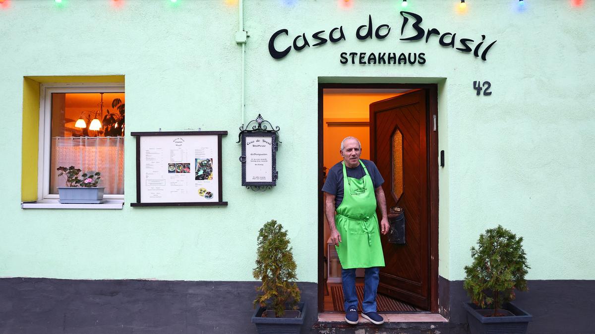 Shoahan Hanan, 63, owner of Casa do Brasil steakhouse stands at the entrance of his restaurant in Schlicht near Vilseck, Germany, May 5, 2026. “A withdraw of 5000 troops in Vilseck, that means a reduction of 50 percent. We will feel the impact.” REUTERS/Lisi Niesner