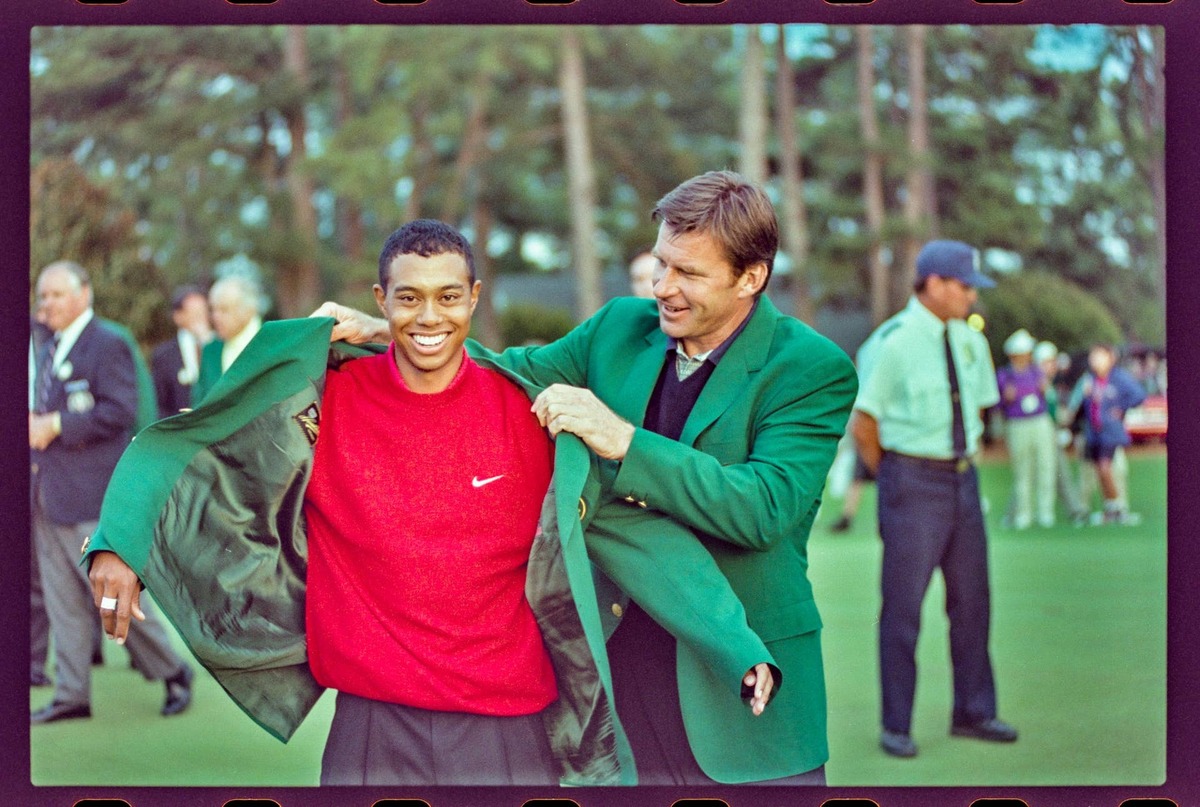  04/13/1997; Augusta, Georgia, USA; Nick Faldo presents Tiger Woods with the green jacket at the Augusta National Golf Course during the 1997 Masters. Mandatory Credit: File Photo -The Augusta Chronicle via USA TODAY NETWORK 