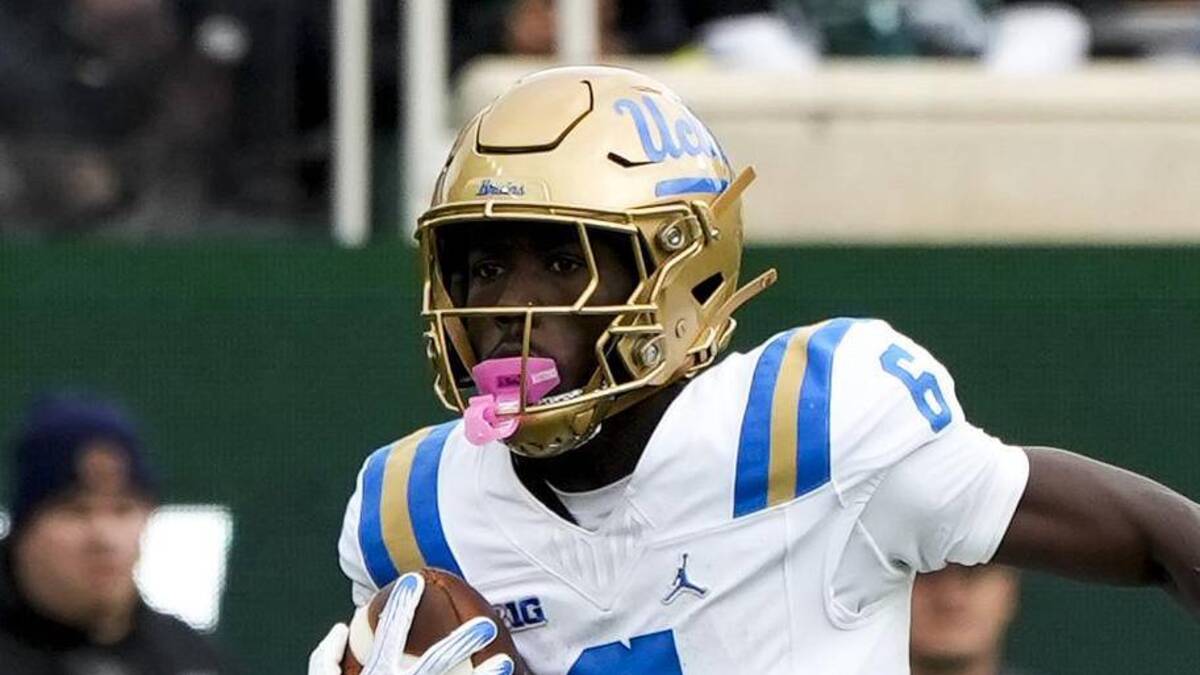  Oct 11, 2025; East Lansing, Michigan, USA; UCLA Bruins running back Anthony Woods (6) runs the ball against the Michigan State defense in the second quarter at Spartan Stadium. Mandatory Credit: Brendan Mullin-Imagn Images | Brendan Mullin-Imagn Images 