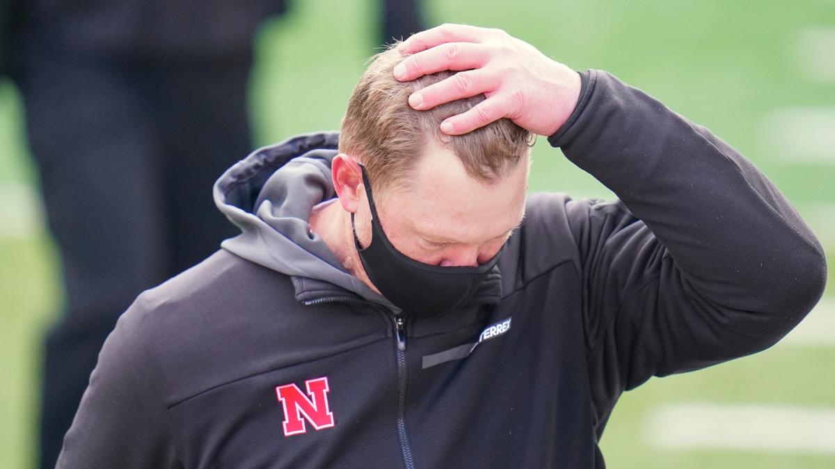 Nebraska head coach Scott Frost walk off the field following an NCAA college football game against Minnesota in Lincoln, Neb., Saturday, Dec. 12, 2020. Minnesota won 24-17. (AP Photo/Nati Harnik)