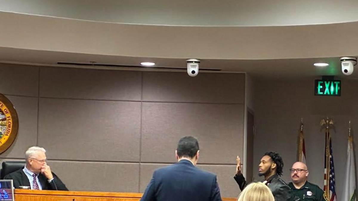 Dexavion J'Neil Brown takes the oath before taking the witness stand in his murder trial on July 9, 2026.
