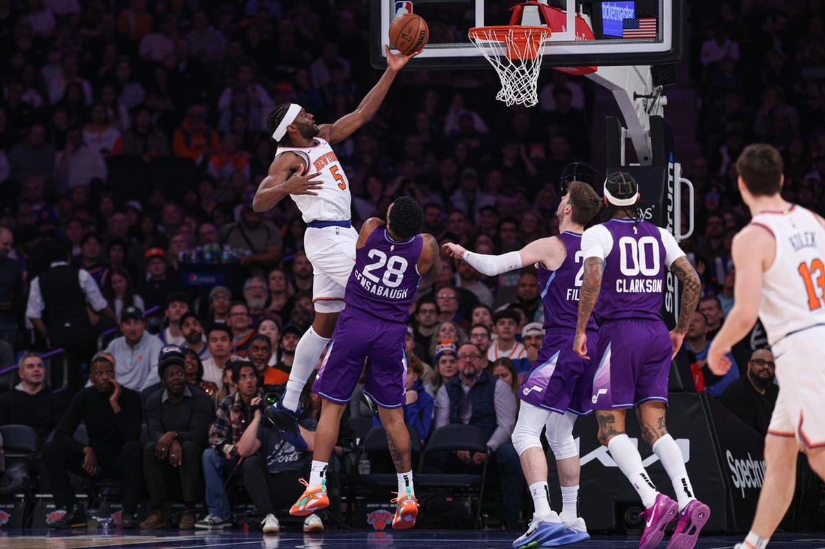 New York Knicks forward Precious Achiuwa (5) goes to the basket as Utah Jazz forward Brice Sensabaugh (28) defends during the first half on Wednesday at Madison Square Garden in New York.