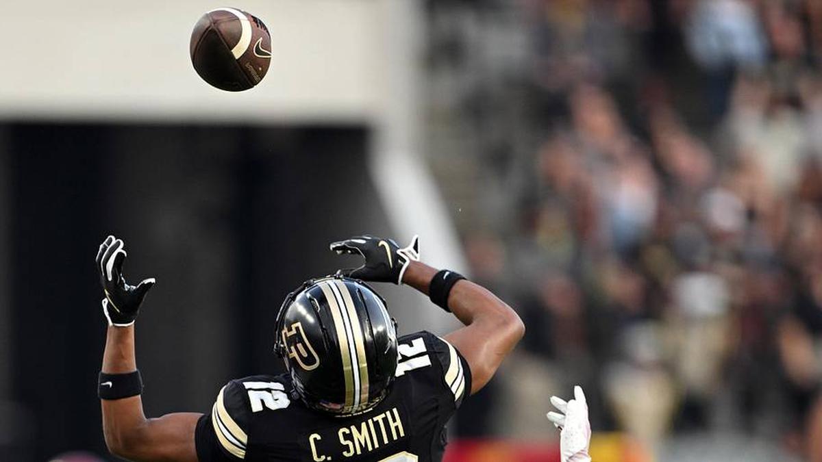  Sep 13, 2025; West Lafayette, Indiana, USA; Purdue Boilermakers wide receiver Corey Smith (12) jumps for a ball that's just out of reach in front of USC Trojans cornerback Chasen Johnson (21) during the first quarter at Ross-Ade Stadium. Mandatory Credit: Marc Lebryk-Imagn Images | Marc Lebryk-Imagn Images 
