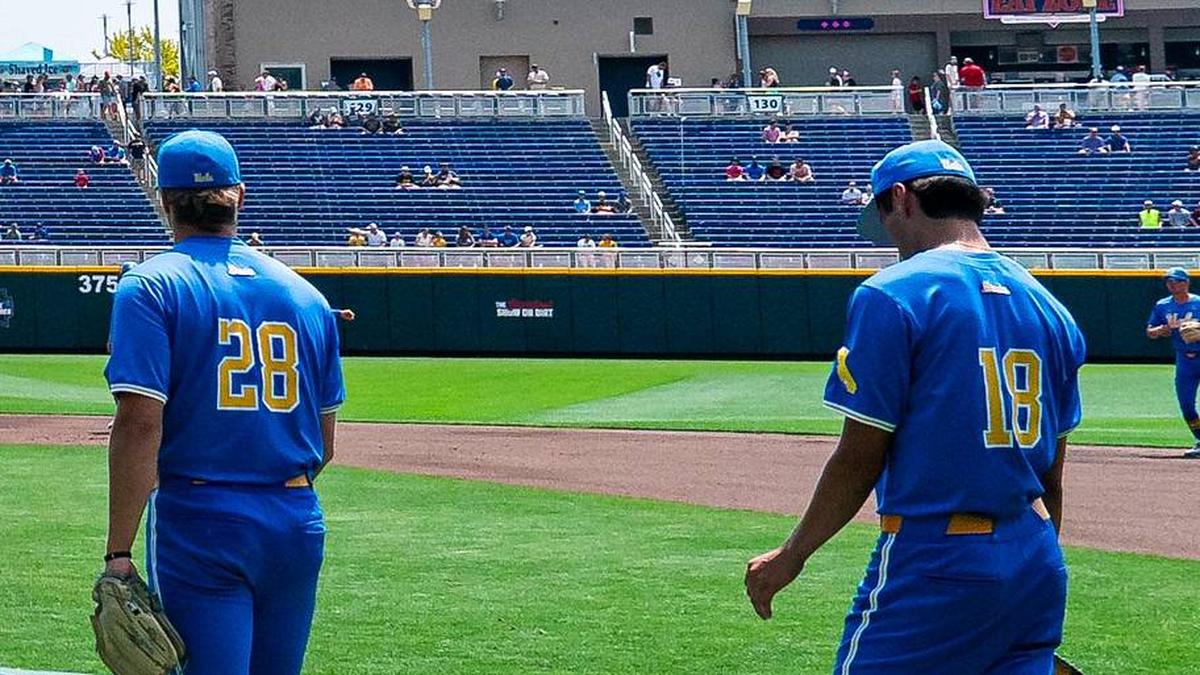  Jun 14, 2025; Omaha, Neb, USA; UCLA Bruins pitcher Cal Randall (28) and pitcher Wylan Moss (18) warm up before the game against the Murray State Racers at Charles Schwab Field. Mandatory Credit: Dylan Widger-Imagn Images | Dylan Widger-Imagn Images 