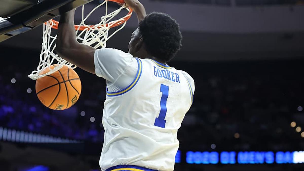  Mar 20, 2026; Philadelphia, PA, USA; UCLA Bruins center Xavier Booker (1) dunks the ball against the UCF Knights in the second half during a first round game of the men's 2026 NCAA Tournament at Xfinity Mobile Arena. Mandatory Credit: Bill Streicher-Imagn Images | Bill Streicher-Imagn Images 