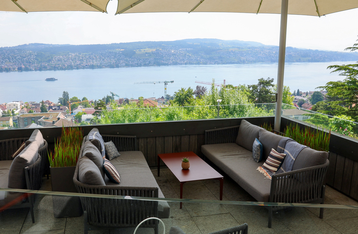 Lake Zurich is seen from the Hotel Belvoir terrace, ahead of a June 14 vote on a plan backed by the right‑wing party to limit population growth to 10 million inhabitants, in Ruschlikon, Switzerland, May 27, 2026. REUTERS/Denis Balibouse
