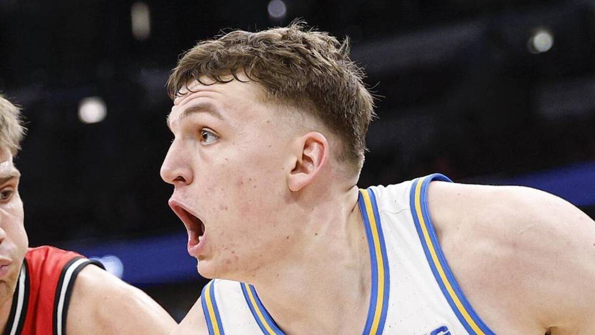  Mar 12, 2026; Chicago, IL, USA; UCLA Bruins forward Tyler Bilodeau (34) drives to the basket against Rutgers Scarlet Knights guard Harun Zrno (13) during the second half at United Center. Mandatory Credit: Kamil Krzaczynski-Imagn Images | Kamil Krzaczynski-Imagn Images 
