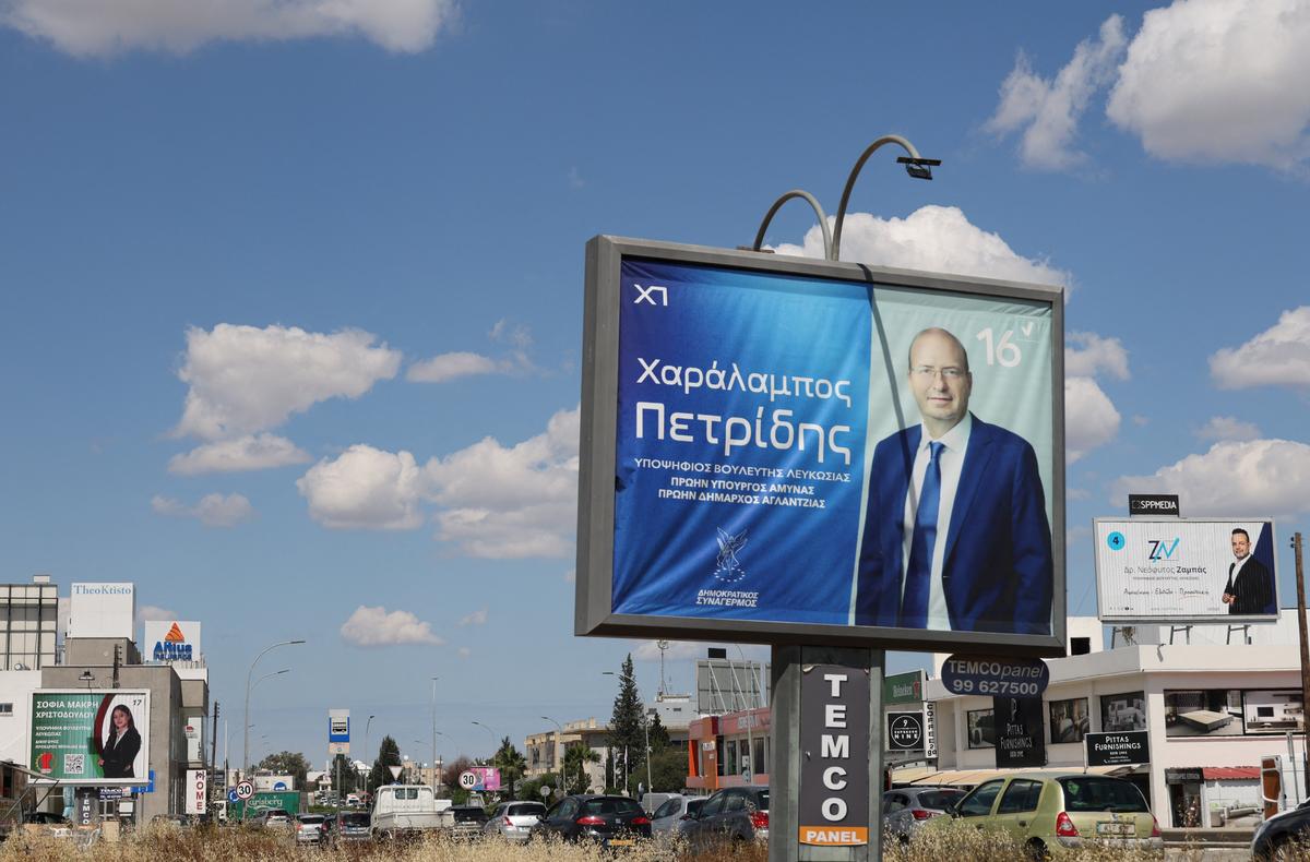 Election campaign billboards of candidates for Cyprus parliamentary election, to be held on May 24, are placed on a street in Nicosia, Cyprus May 6, 2026. REUTERS/Yiannis Kourtoglou