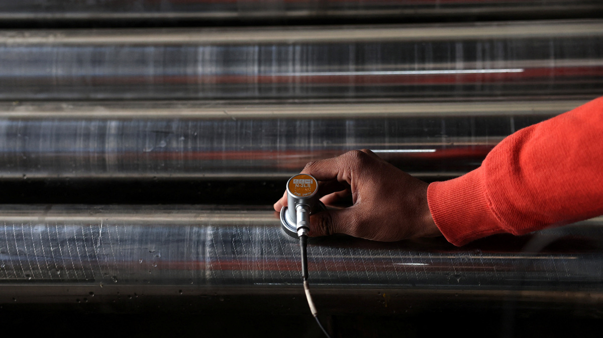 A worker checks for minor cracks on steel bars with an ultrasound machine, inside a steel factory on the outskirts of Ahmedabad, India, January 28, 2026. REUTERS/Amit Dave