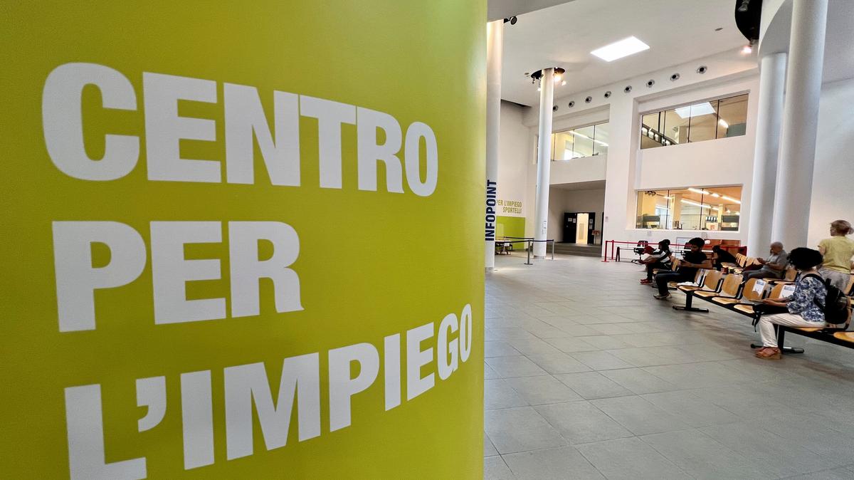 People wait at an employment centre in Milan, Italy June 14, 2022. Picture taken June 14, 2022. REUTERS/Flavio Lo Scalzo