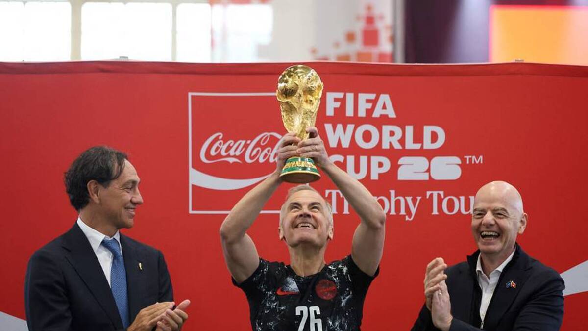  Canadian Prime Minister Mark Carney (center) lifted the World Cup trophy ahead of the tournament. | Dave Chan/AFP/Getty Images 