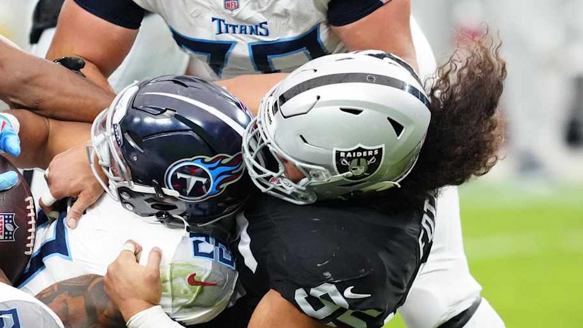  Oct 12, 2025; Paradise, Nevada, USA; Tennessee Titans running back Tony Pollard (20) is tackled during the second half against the Las Vegas Raiders at Allegiant Stadium. Mandatory Credit: Stephen R. Sylvanie-Imagn Images | Stephen R. Sylvanie-Imagn Images 
