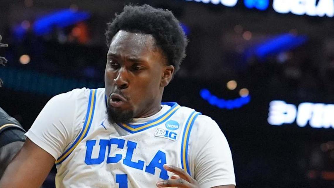  Mar 20, 2026; Philadelphia, PA, USA;UCF Knights center John Bol (7) grabs a rebound againist UCLA Bruins center Xavier Booker (1) in the first half during a first round game of the men's 2026 NCAA Tournament at Xfinity Mobile Arena. Mandatory Credit: Kyle Ross-Imagn Images | Kyle Ross-Imagn Images 
