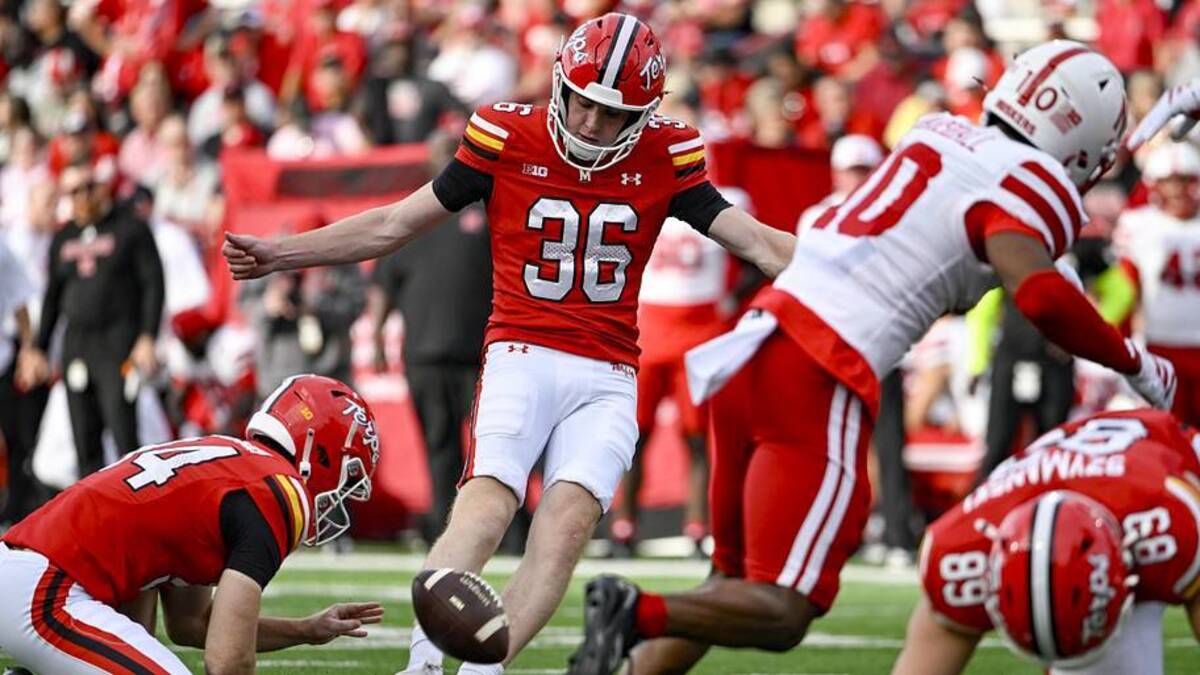  Oct 11, 2025; College Park, Maryland, USA; Maryland Terrapins place kicker Sean O'Haire (36) kicks an extra point as wide receiver Jordan Scott (14) holds during the game against the Nebraska Cornhuskers at SECU Stadium. Mandatory Credit: Tommy Gilligan-Imagn Images | Tommy Gilligan-Imagn Images 