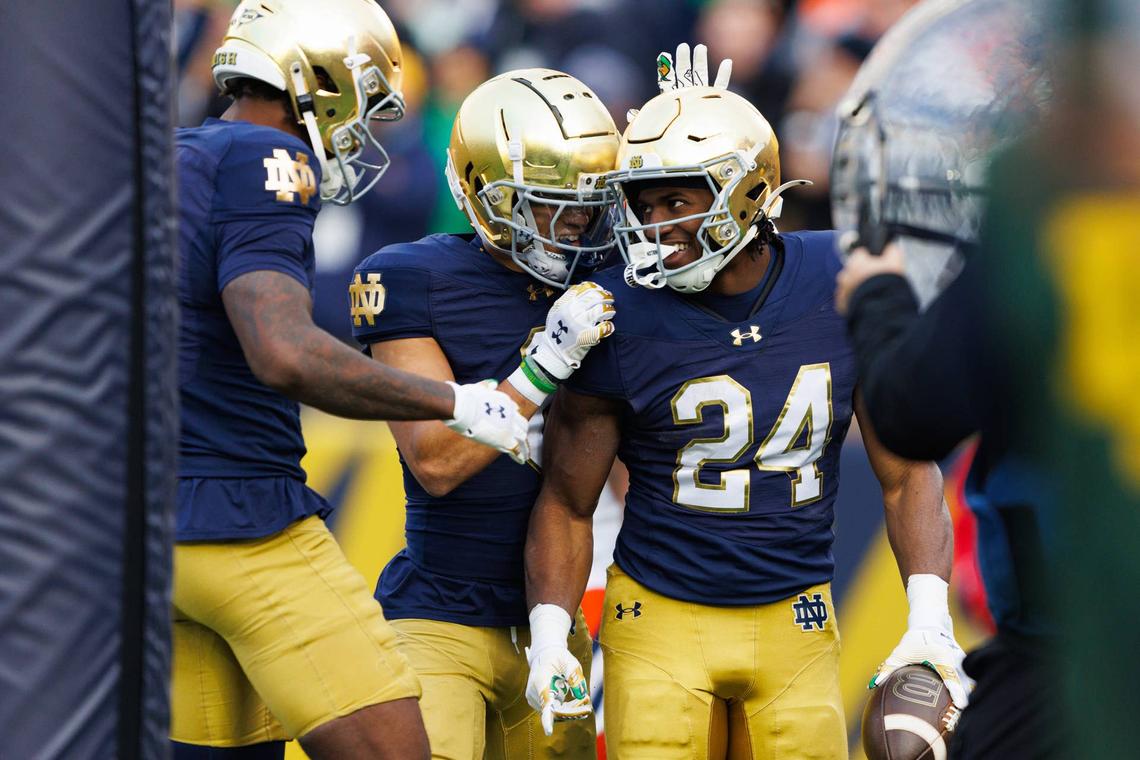  Notre Dame running back Jadarian Price (24) celebrates after scoring a touchdown in the first half of a NCAA football game against Syracuse at Notre Dame Stadium on Saturday, Nov. 22, 2025, in South Bend. 