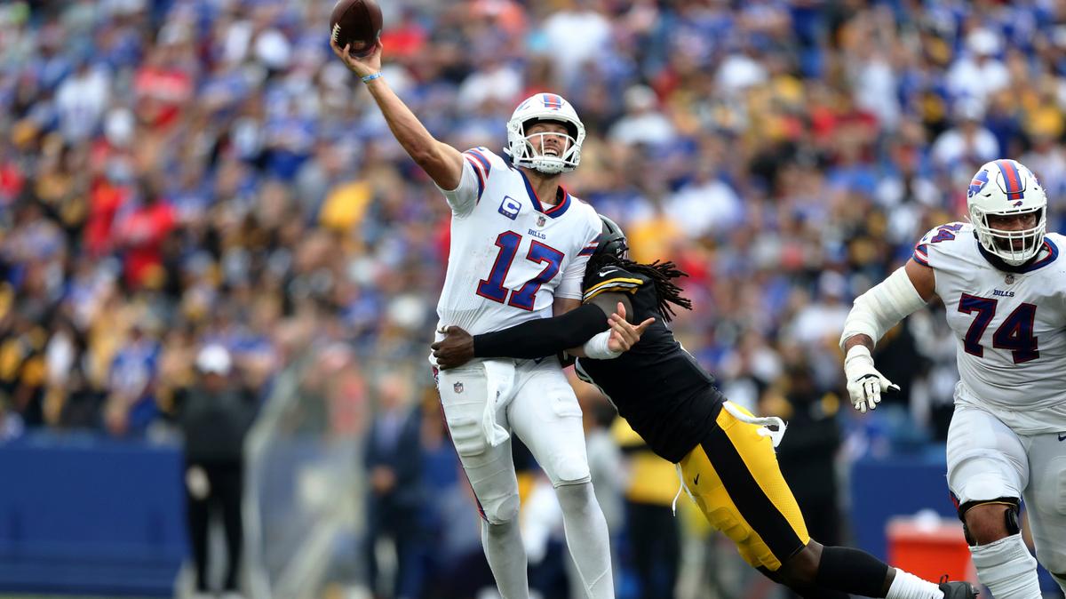 Buffalo Bills quarterback Josh Allen (17) gets off a pass as he is hit by Pittsburgh Steelers linebacker Melvin Ingram during the second half of an NFL football game in Orchard Park, N.Y., Sunday, Sept. 12, 2021.