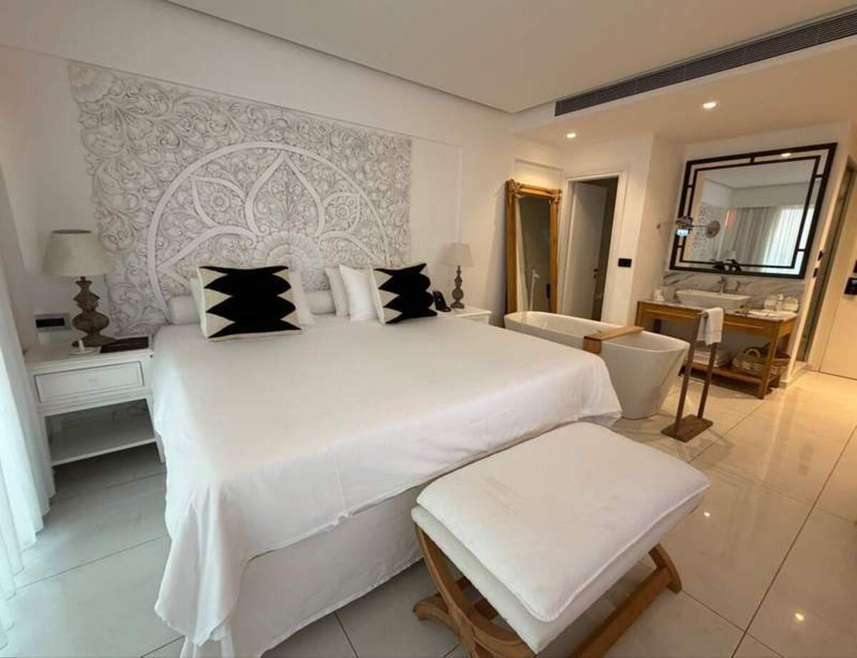  The Abaton's suites are designed to invoke calm and peace, providing the perfect sanctuary for couples seeking to rest and reconnect. The spaces include marble tiles, white washed decor and plush bedding. Photo credit: Erika Ebsworth-Goold 