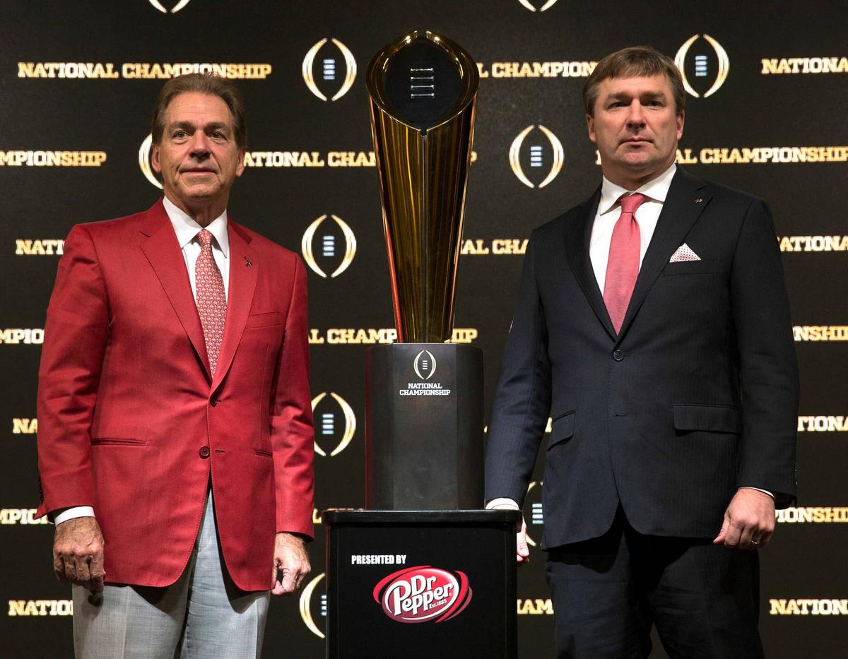  ATLANTA, GA - JANUARY 07: University of Alabama head coach Nick Saban (left) and University of Georgia head coach Kirby Smart stand with the College Football Playoff National Championship trophy after a Coaches Press Conference on January 7, 2018 in Atlanta, Georgia. (Photo by Mike Zarrilli/Getty Images) 