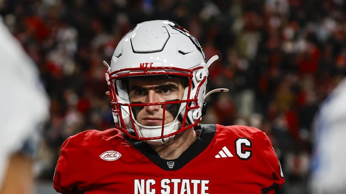  Nov 29, 2025; Raleigh, North Carolina, USA; NC State Wolfpack defensive end Cian Slone (8) at the coin toss before the first half of the game against North Carolina Tar Heels at Carter-Finley Stadium. Mandatory Credit: Jaylynn Nash-Imagn Images | Jaylynn Nash-Imagn Images 