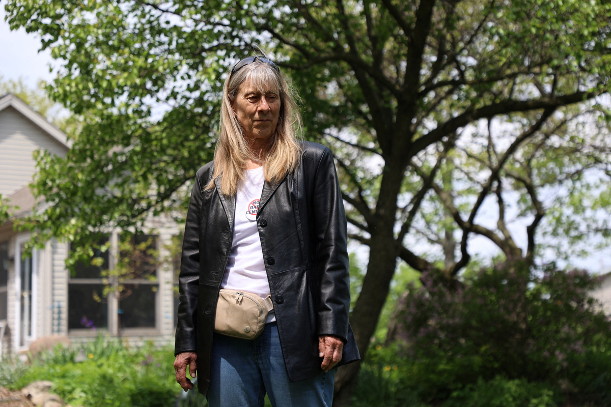 Christine Coultrip poses outside her house in Perrysburg, Ohio, U.S., May 12, 2026. Coultrip worries she will lose her home amid rumors of a new hyperscale data center in Perrysburg. REUTERS/Eric Cox
