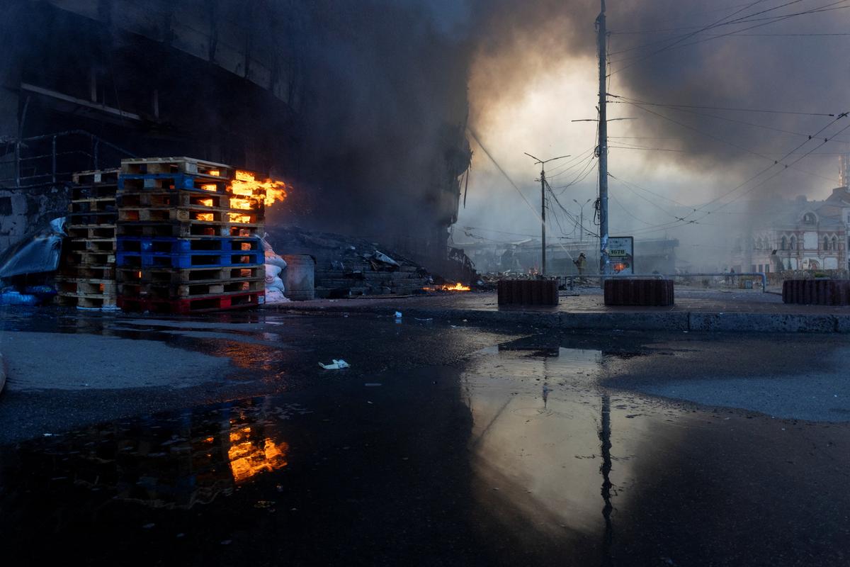 A firefighter works at the site of a fire after overnight Russian missile and drone attacks, amid Russia's attack on Ukraine, in Kyiv, Ukraine, May 24, 2026. REUTERS/Thomas Peter