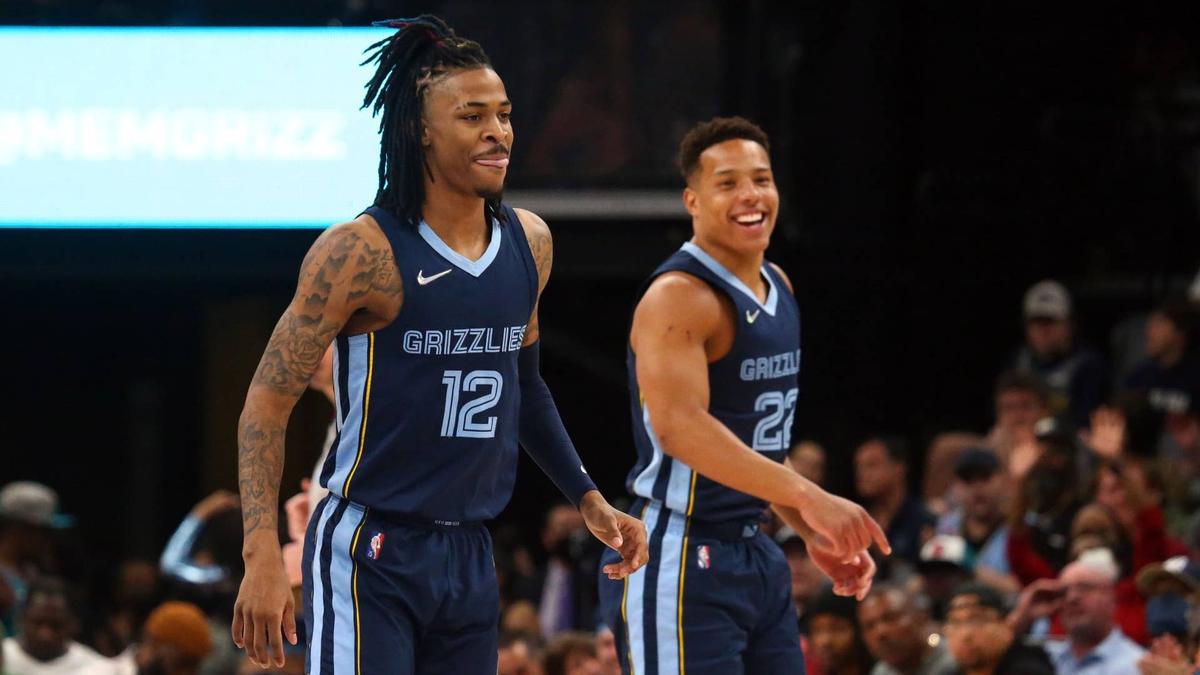  Memphis Grizzles guard Ja Morant (12) reacts with guard Desmond Bane (22) after a basket against the Orlando Magic. © Petre Thomas-Imagn Images