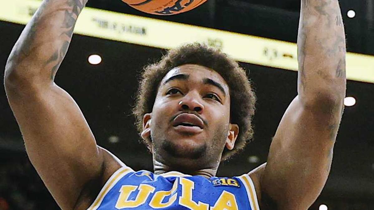  Mar 13, 2026; Chicago, IL, USA; UCLA Bruins guard Brandon Williams (5) scores against the Michigan State Spartans during the first half at United Center. Mandatory Credit: Kamil Krzaczynski-Imagn Images | Kamil Krzaczynski-Imagn Images 