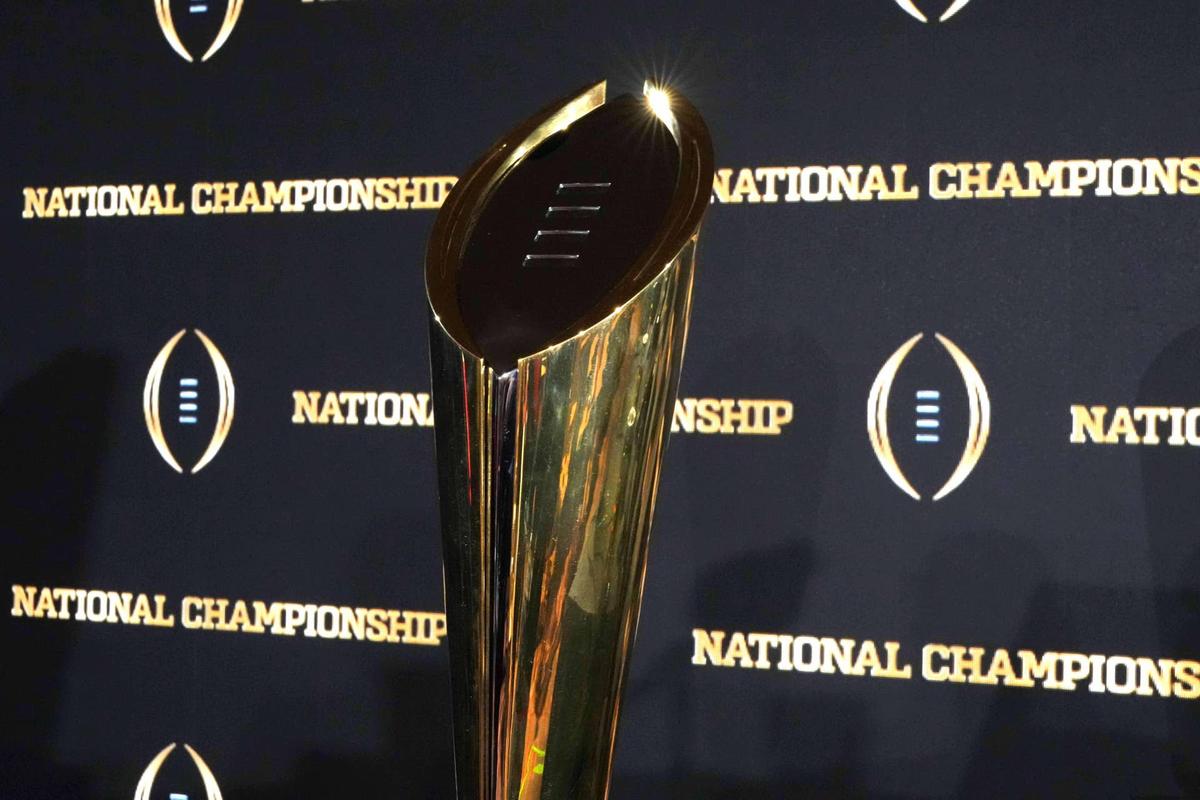  Jan 21, 2025; Atlanta, GA, USA; The College Football Playoff National Championship trophy at press conference at The Westin Peachtree Plaza, Savannah Ballroom. Mandatory Credit: Kirby Lee-Imagn Images 