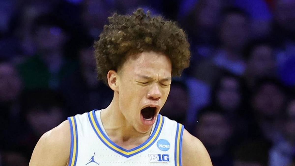  Mar 20, 2026; Philadelphia, PA, USA; UCLA Bruins guard Trent Perry (0) reacts with guard Eric Freeny (8) in the second half during a first round game of the men's 2026 NCAA Tournament at Xfinity Mobile Arena. Mandatory Credit: Bill Streicher-Imagn Images | Bill Streicher-Imagn Images 