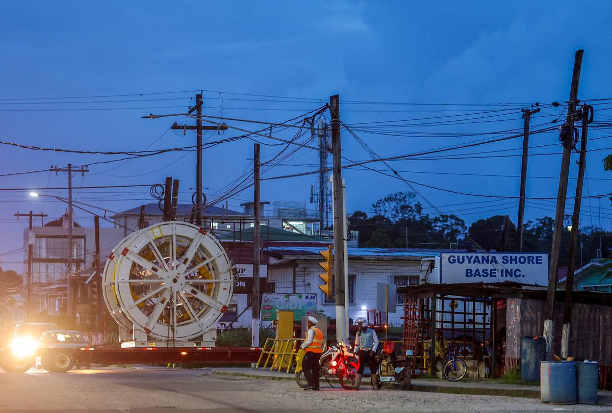 A truck hauls a piece of machinery into the Guyana Shore Base, part of Guyana's oil and gas infrastructure, as Guyana's fast-growing economy is set to benefit from a reshaped global energy market due to the U.S.-Israeli war on Iran, in Georgetown, Guyana May 9, 2026. REUTERS/Yancey Haywood