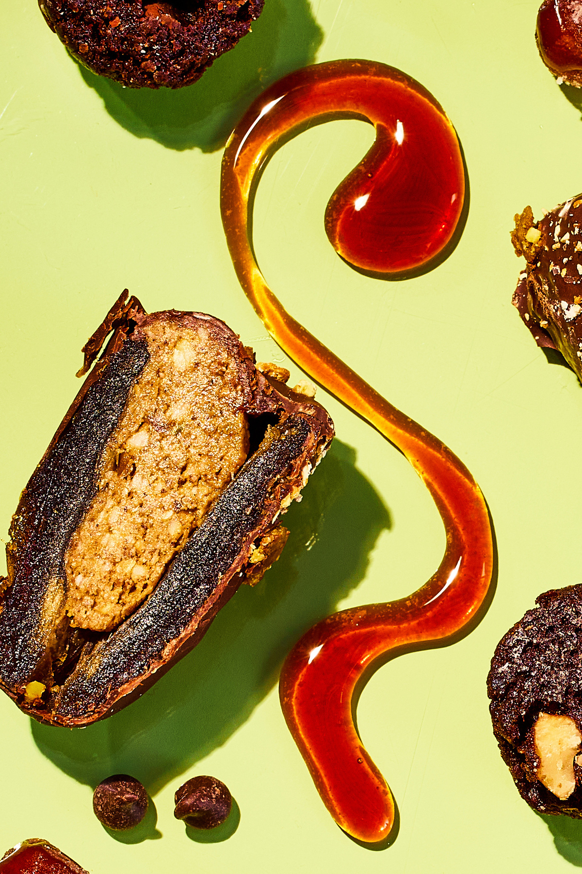 Snack foods based on dates are arranged for a photograph in New York on May 26, 2026. Whole dates are luxurious on their own. Coated in chocolate or dusted in sour sugar, they're delicious, though not exactly a health food. Prop Stylist: JoJo Li. (Julia Gartland/The New York Times)