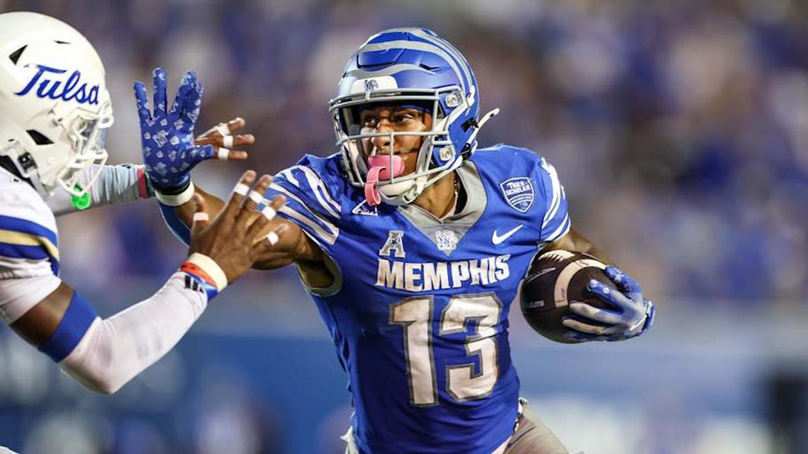  Oct 4, 2025; Memphis, Tennessee, USA; Memphis Tigers running back Greg Desrosiers Jr. (13) runs with the ball against the Tulsa Golden Hurricane during the first half at Simmons Bank Liberty Stadium. Mandatory Credit: Wesley Hale-Imagn Images | Wesley Hale-Imagn Images 