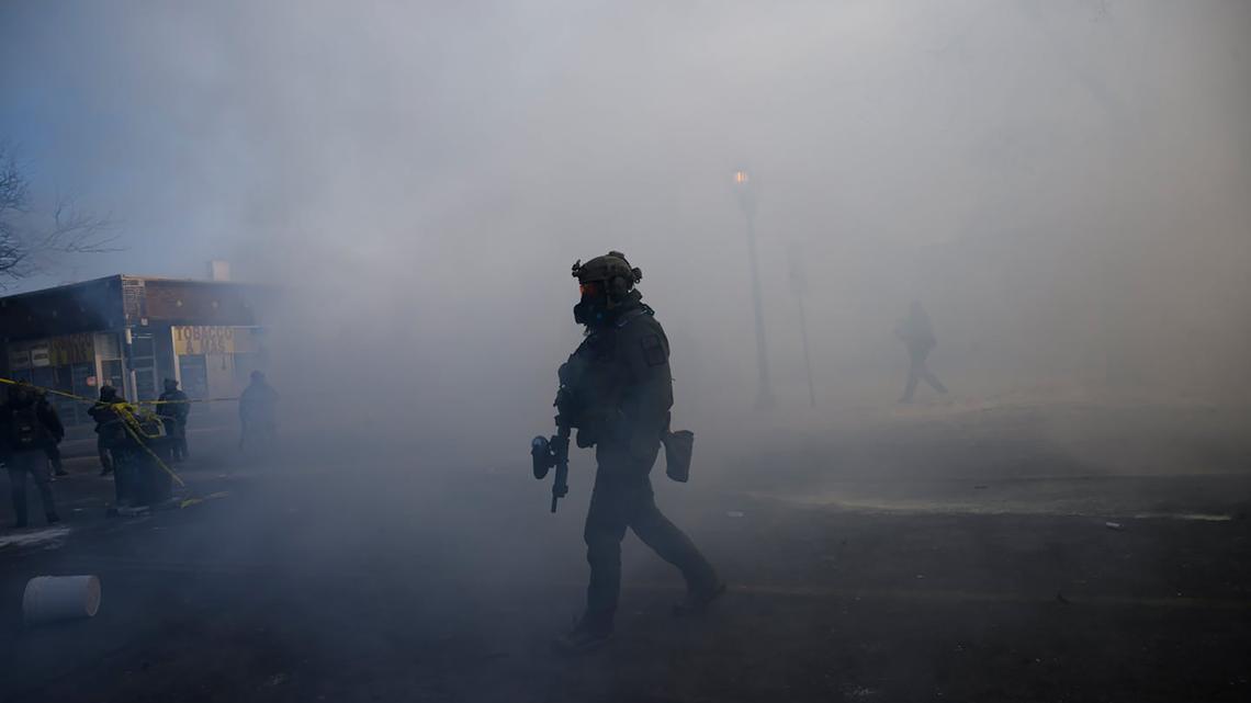 Tear gas fills the air on Nicollet Avenue near West 27th Street after a federal agent fatally shot a person nearby on Saturday, Jan. 24, 2026, in Minneapolis. (Aaron Lavinsky/The Minnesota Star Tribune/TNS)