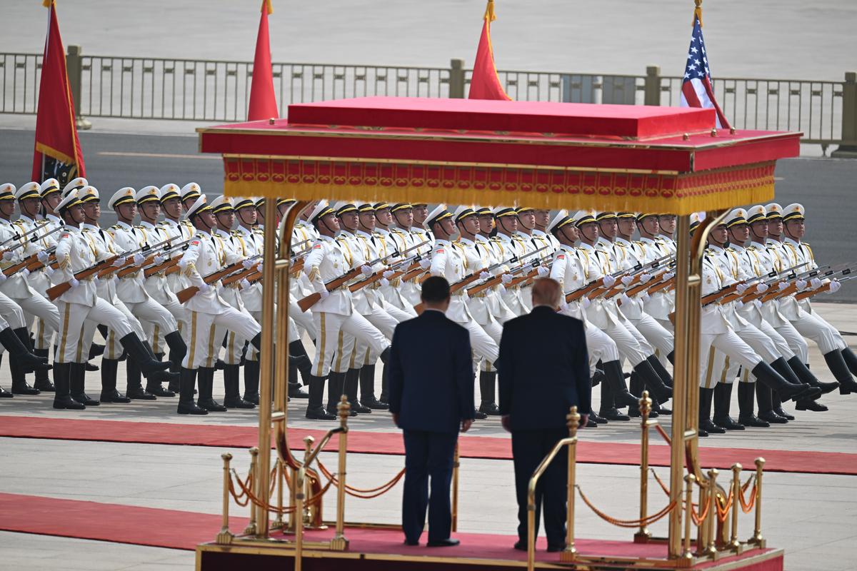 President Xi Jinping of China and President Donald Trump review a military parade outside the Great Hall of the People in Beijing during their two-day summit, on Thursday, May 14, 2026. During the first U.S. presidential visit to China in nearly a decade, Xi delivered a warning on Taiwan, saying that the issue, if handled poorly, could lead to conflict and "an extremely dangerous situation." (Kenny Holston/The New York Times)..