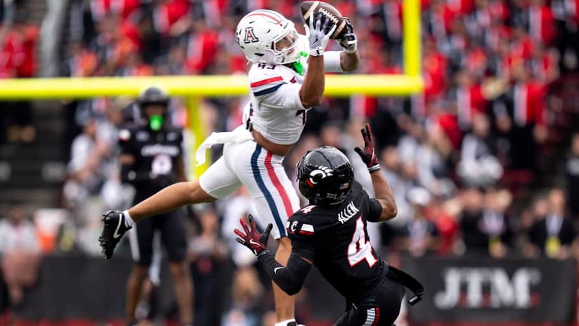  Arizona Wildcats defensive back Dalton Johnson (43) intercepts a pass intended for Cincinnati Bearcats wide receiver Cyrus Allen (4) in the second quarter of the NCAA football game between the Cincinnati Bearcats and Arizona Wildcats at Nippert Stadium in Cincinnati on Nov. 15, 2025. | Albert Cesare/The Enquirer / USA TODAY NETWORK via Imagn Images 