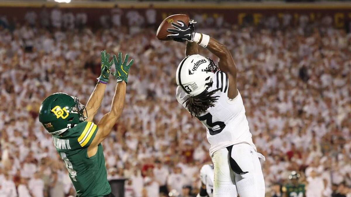  Oct 5, 2024; Ames, Iowa, USA; Iowa State Cyclones defensive back Jontez Williams (3) intercepts a pass intended for Baylor Bears wide receiver Monaray Baldwin (4) at Jack Trice Stadium. Mandatory Credit: Reese Strickland-Imagn Images | Reese Strickland-Imagn Images 