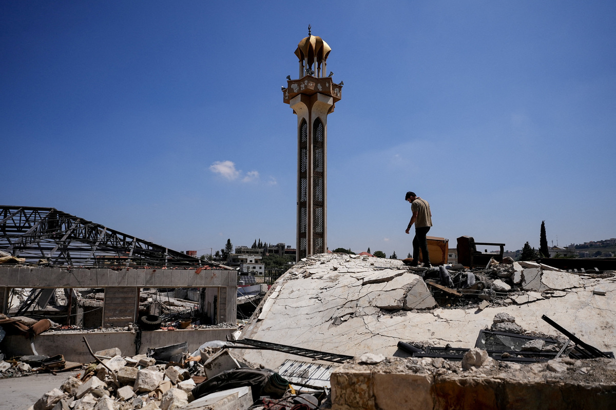 A man inspects the damage in Jibchit in the Nabatieh district, Lebanon, June 16, 2026, following a deal between the United States and Iran. REUTERS/Stringer