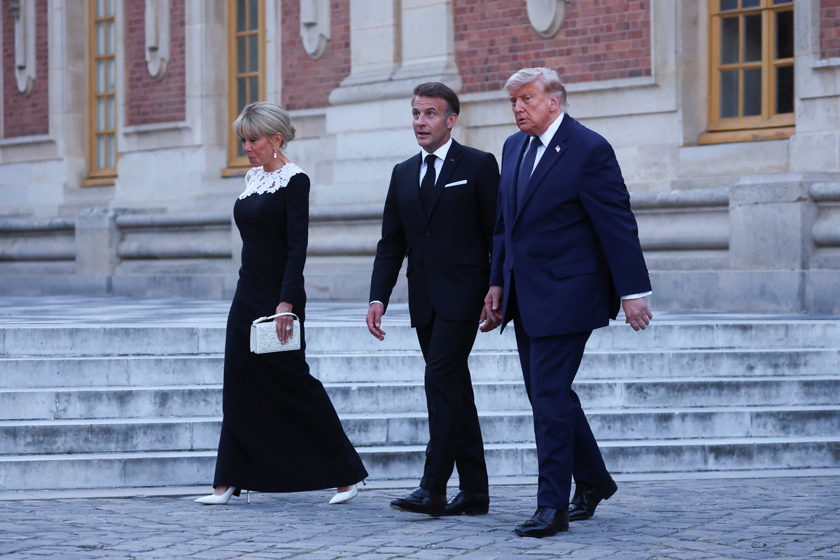 French President Emmanuel Macron and his wife Brigitte Macron welcome U.S. President Donald Trump for a dinner commemorating the 250th anniversary of the United States' independence, at the Palace of Versailles, near Paris, France, June 17, 2026. REUTERS/Gonzalo Fuentes